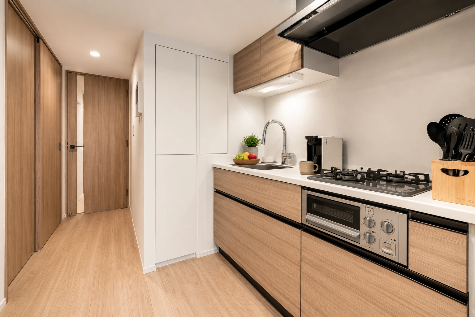 Type A · 2-Bedroom Suite: kitchen light wood cabinets stove