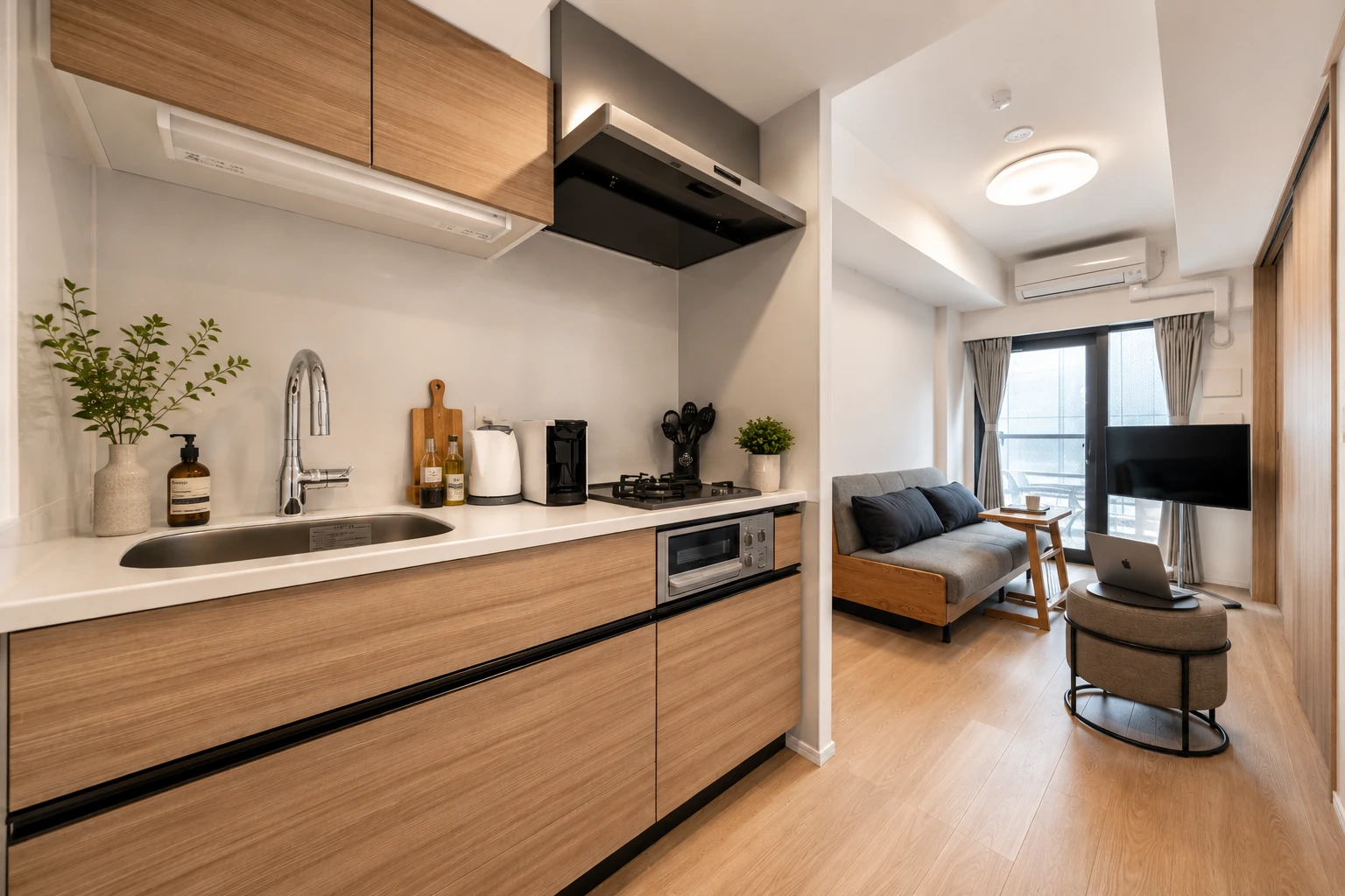Type A · 2-Bedroom Suite: kitchen wood cabinets living room view
