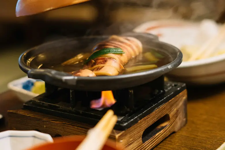 A simmering pot on the counter of an old shop.